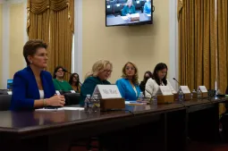 Maria Roat, Margie Graves, Suzette Kent and Erie Meyer sit at a long table in a hearing room on Capitol Hill.